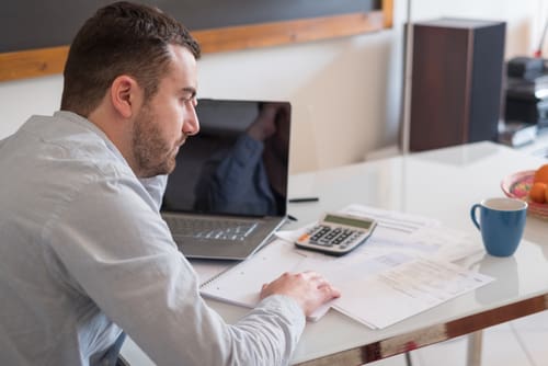 A business owner looking over his taxes