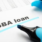SBA loan underlined words and marker.
