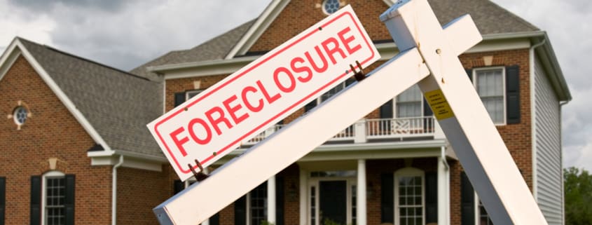 Foreclosure sign in front on modern house