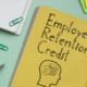 Employee Retention Credit ERC is shown on a business photo using the text