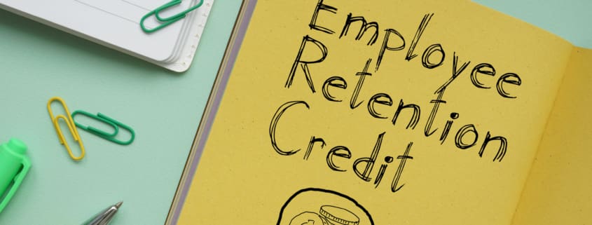 Employee Retention Credit ERC is shown on a business photo using the text