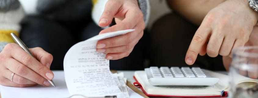 Man and woman doing calculations