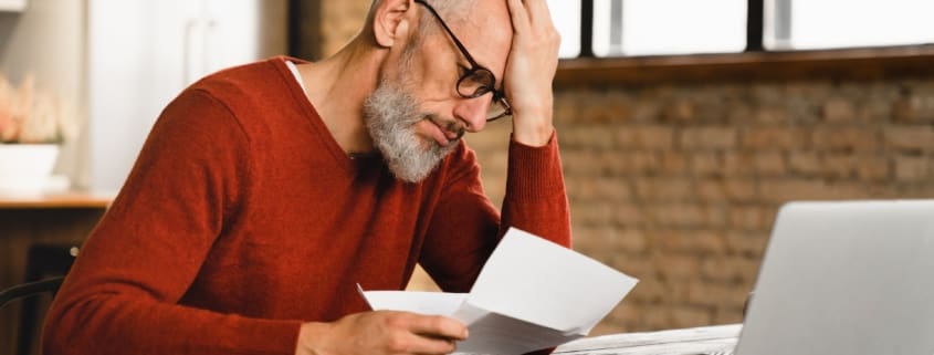 Man looking at a paper