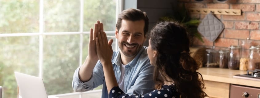 Man and woman doing high five