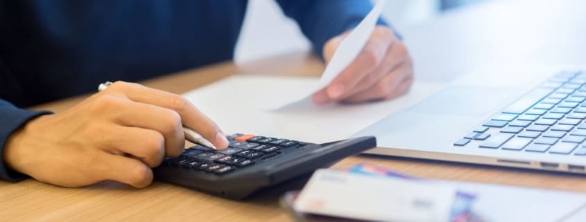 Man using a calculator