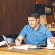 Man on a table with a laptop