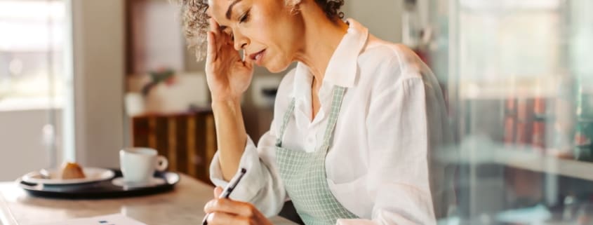 Woman writing on a notebook