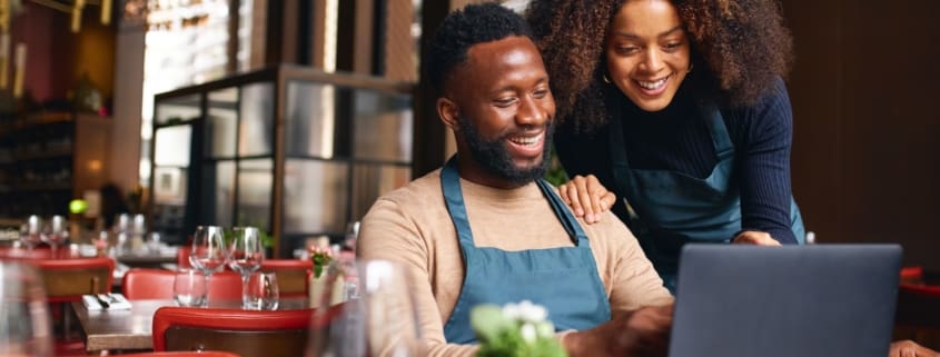 Man and woman using a laptop